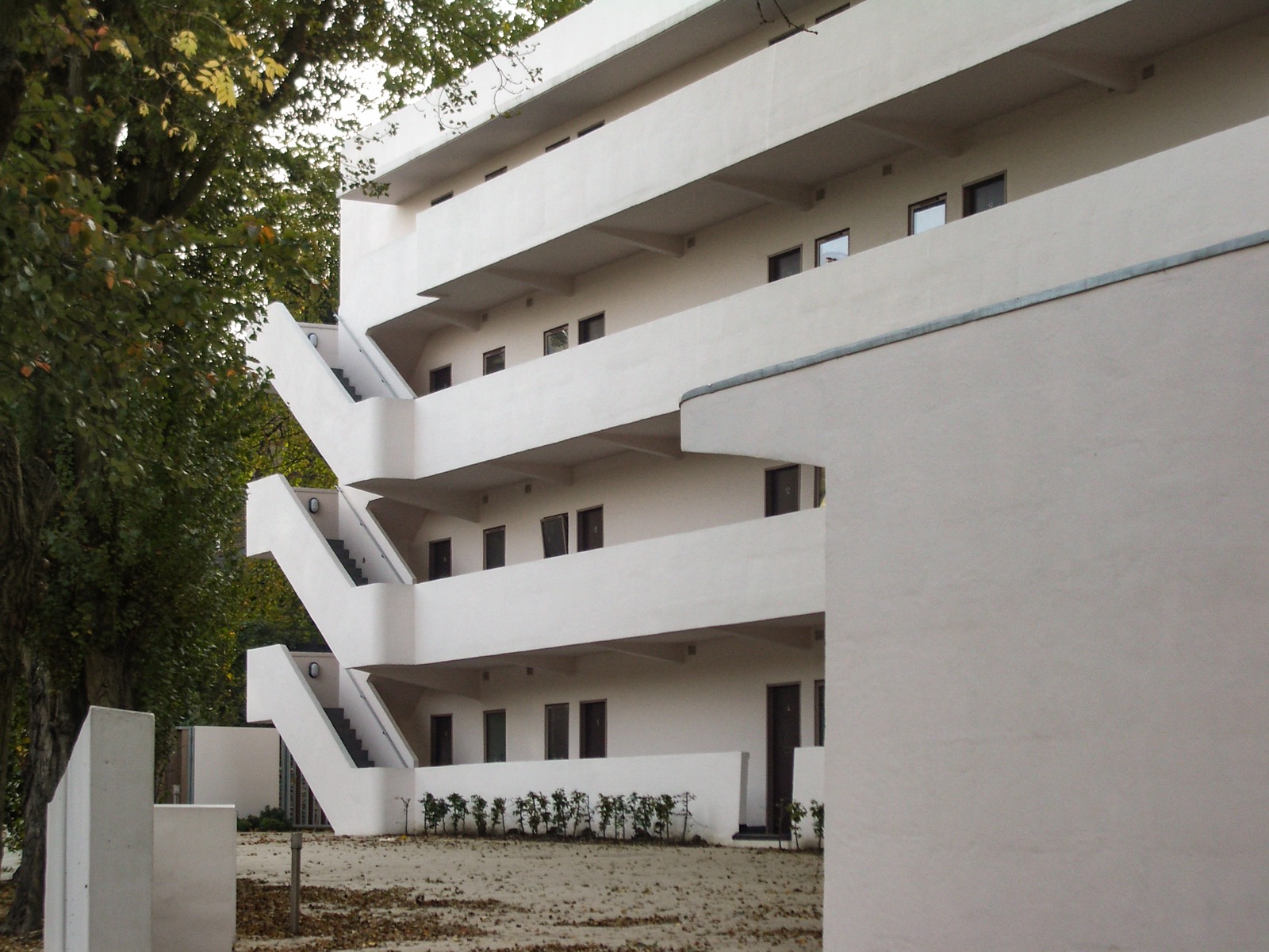The Isokon building, Lawn Road Flats, in Hampstead, London, a white modernist concrete apartment block with cantilevered balconies