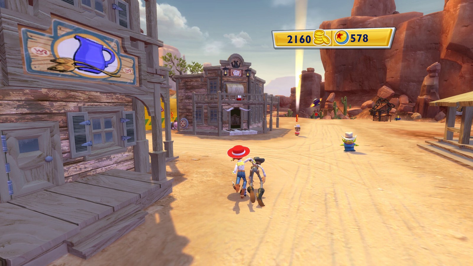Screenshot of Woody and Jessie walking down the Toy Box town street, with a coin counter at the top right