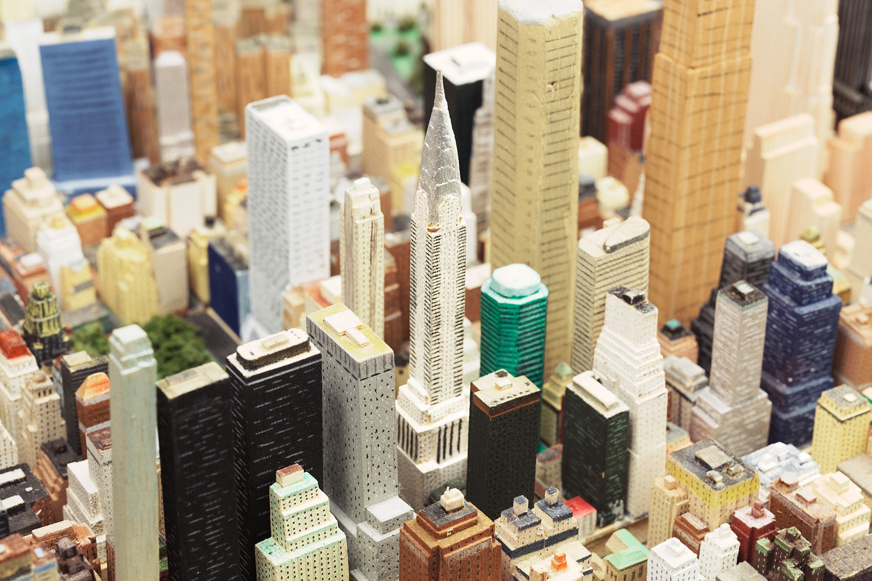 Close-up of a handmade model of Midtown Manhattan in balsa wood and cardboard, with the Chrysler Building in the centre