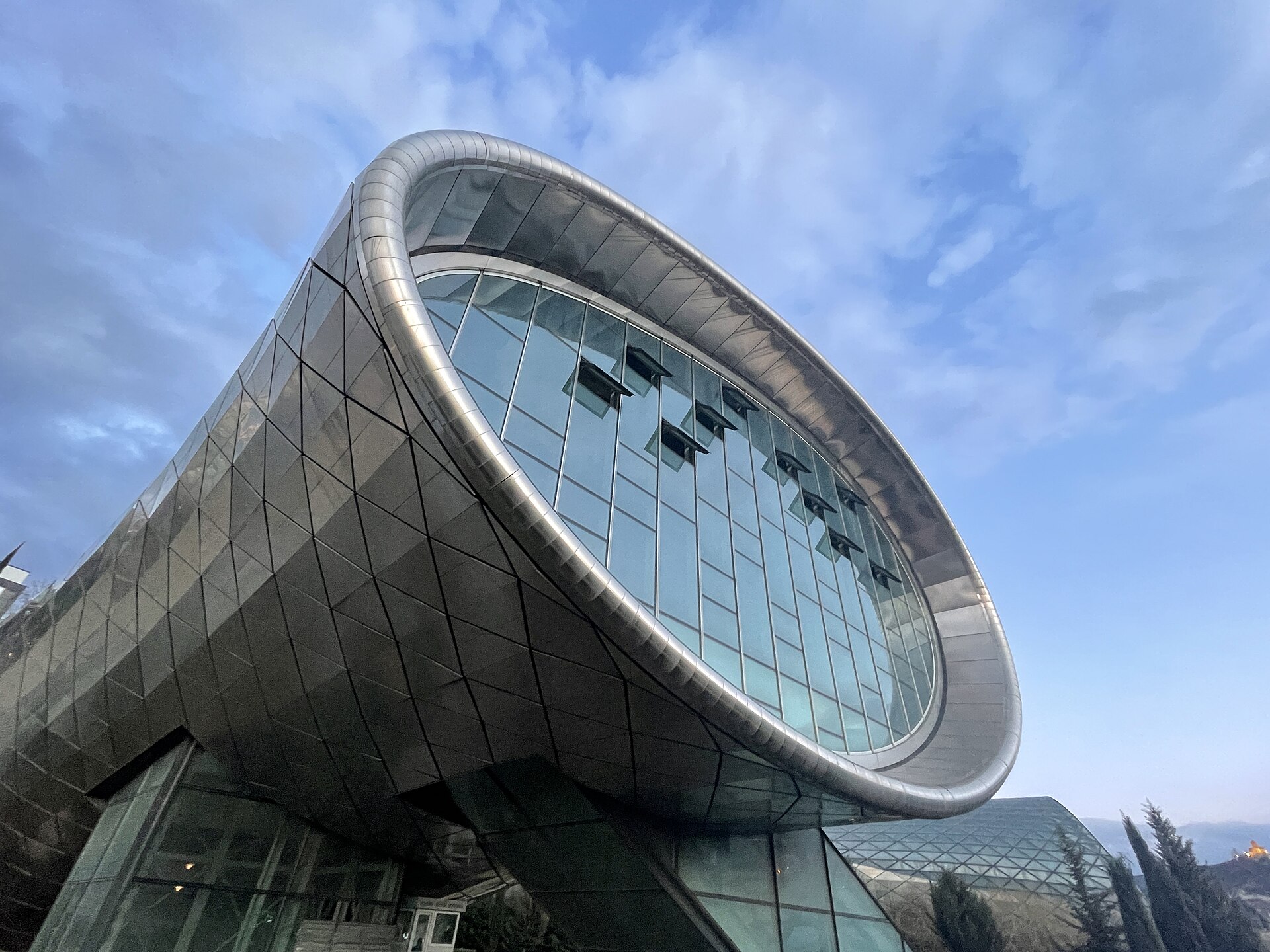 The open mouth of one of the Rike Tubes against a blue sky