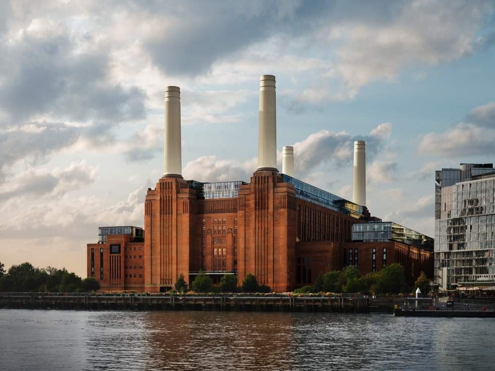 Battersea Power Station across the Thames, with its four white chimneys, home of Apple Music Hall